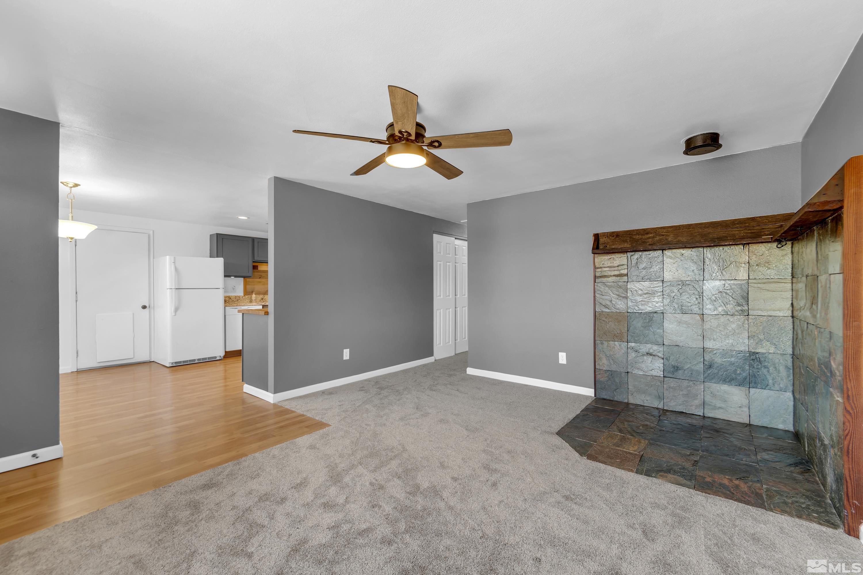 635 Wiggins Court Reno, NV 89506 - Photo 2 of 20 a view of a livingroom with a ceiling fan & entryway