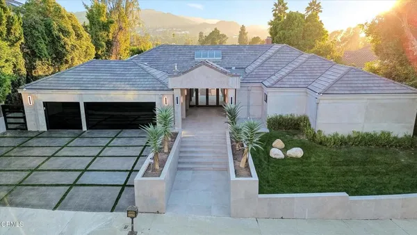 a house view with a garden space