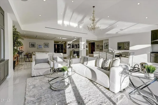 a kitchen with stainless steel appliances kitchen island granite top and refrigerator
