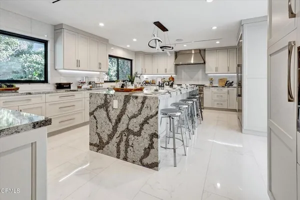 a very nice looking dining room with furniture window and outside view