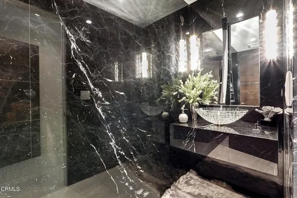 a bathroom with a double vanity sink and mirror