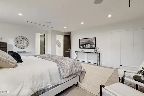 a en suite bathroom with a granite countertop sink a toilet and shower