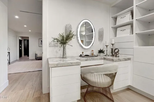 a bed room with a bed and a night stand