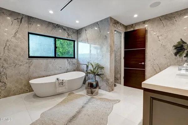 a bathroom with a double vanity sink toilet and shower