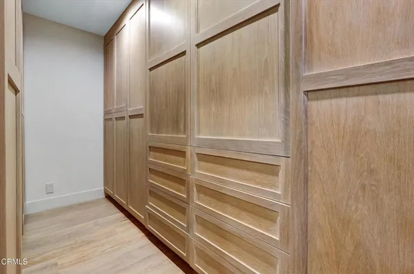 a view of a hallway with a glass door shower