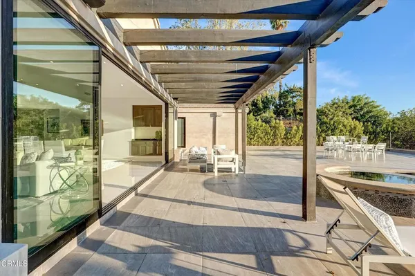 an aerial view of a fireplace with table and chairs