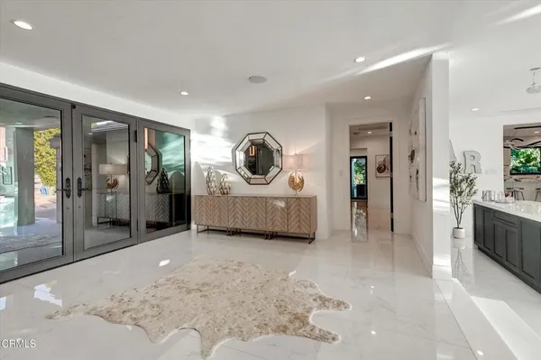 a view of a livingroom with a tub and bathroom