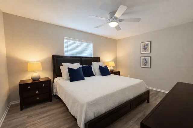 a bedroom with bed and a window