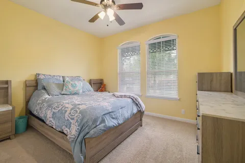 a bedroom with a bed and window