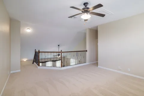 a view of staircase with wooden floor