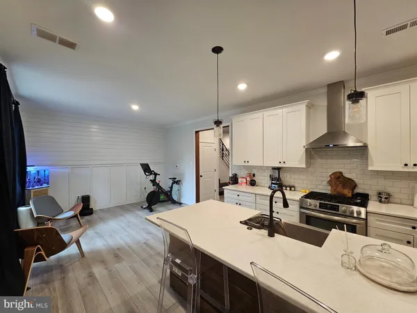 a kitchen with a sink appliances and cabinets