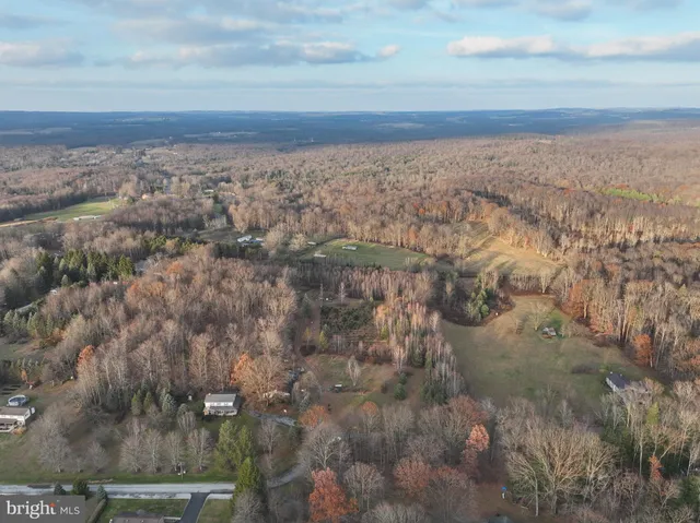 an aerial view of residential building and green space