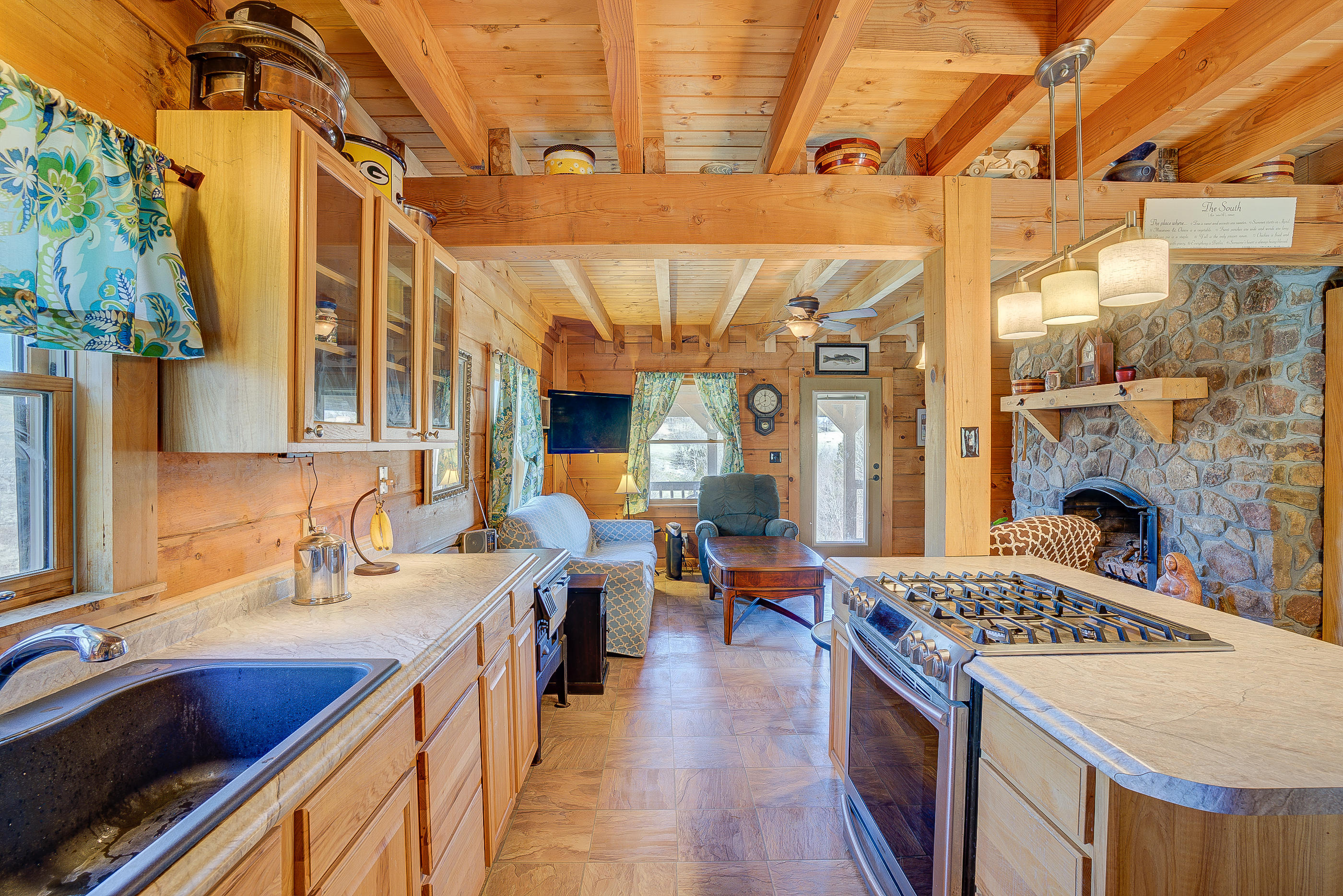 5076 Green Valley Road Lebanon, VA 24266 - Photo 6 of 57 a kitchen with a sink a stove and a table