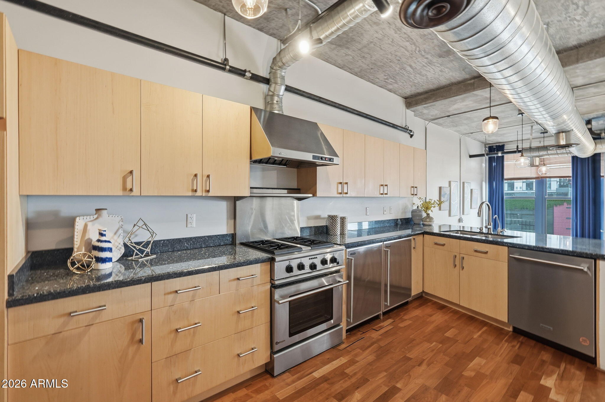 21 East 6th Street, Unit 608 Tempe, AZ 85281 - Photo 1 of 25 a kitchen with stainless steel appliances granite countertop a stove a sink and white cabinets