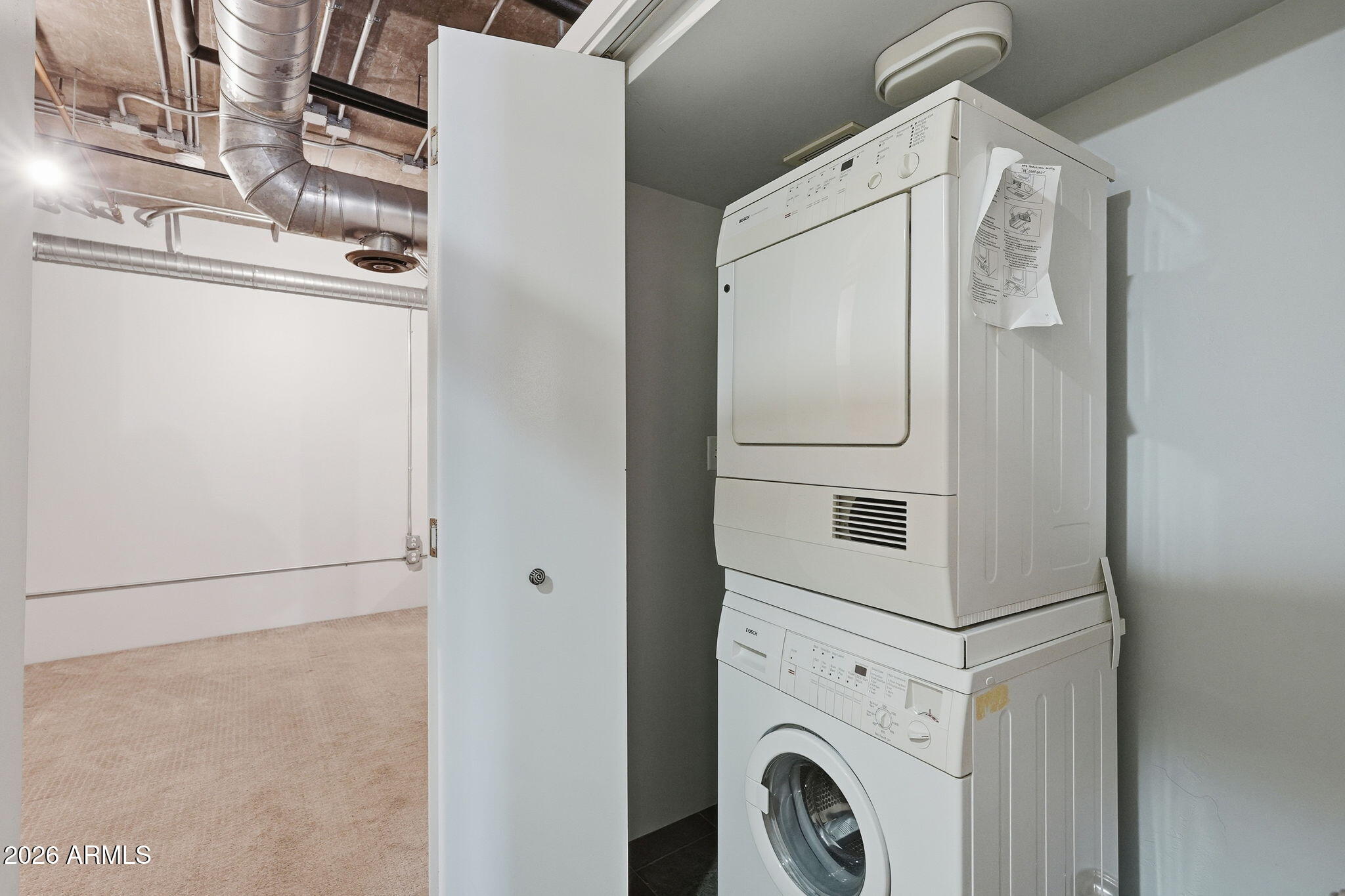 21 East 6th Street, Unit 608 Tempe, AZ 85281 - Photo 11 of 25 a utility room with dryer and washer