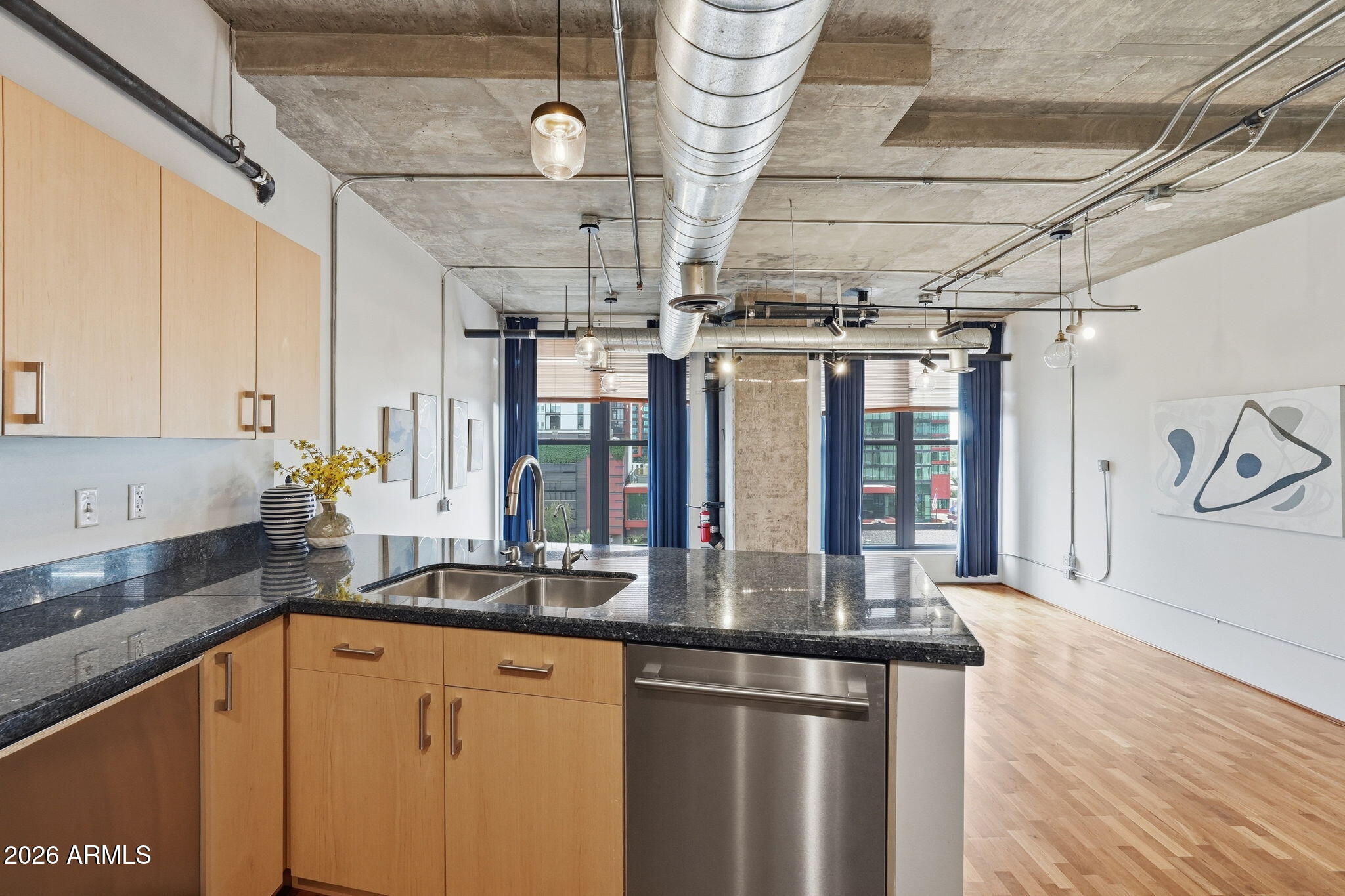 21 East 6th Street, Unit 608 Tempe, AZ 85281 - Photo 3 of 25 a kitchen with stainless steel appliances granite countertop a sink a stove and cabinets