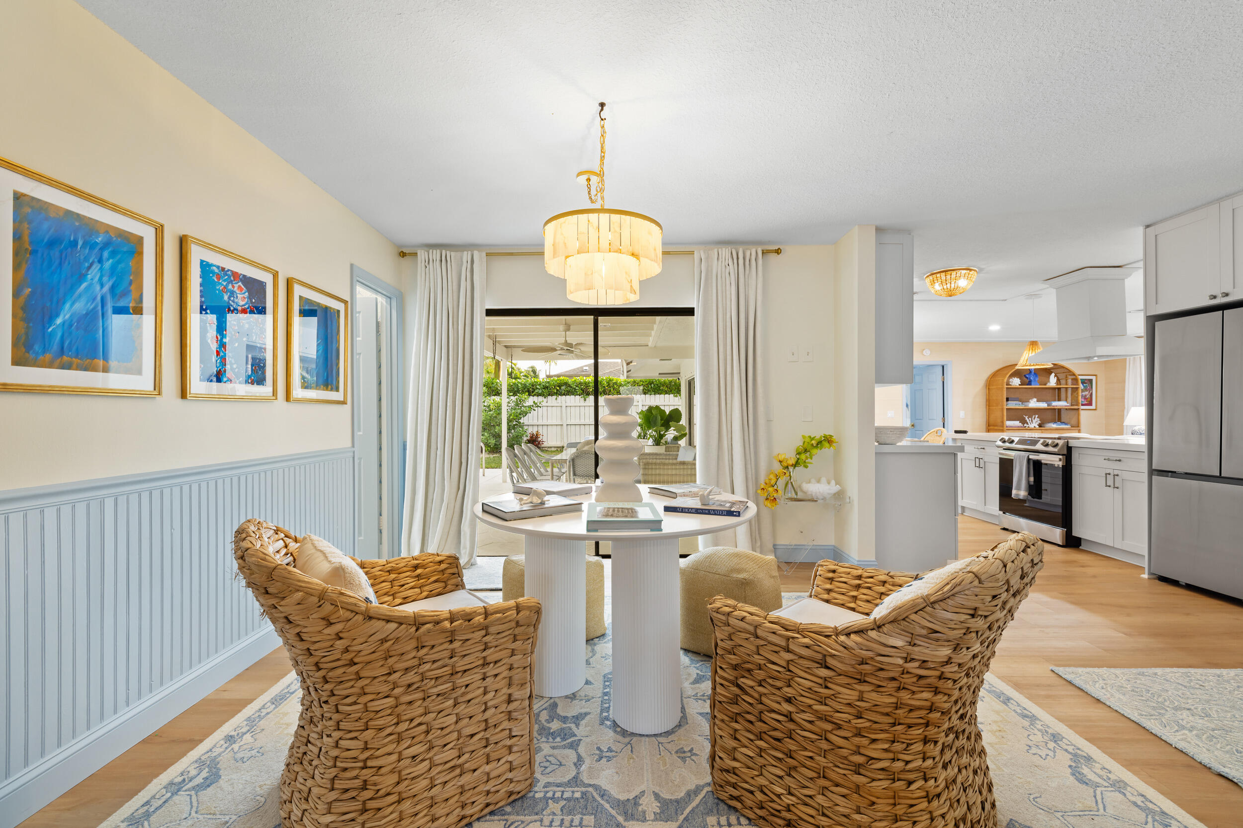 2512 Southwest 5th Street Boynton Beach, FL 33435 - Photo 13 of 37 a living room with furniture a chandelier and a dining table