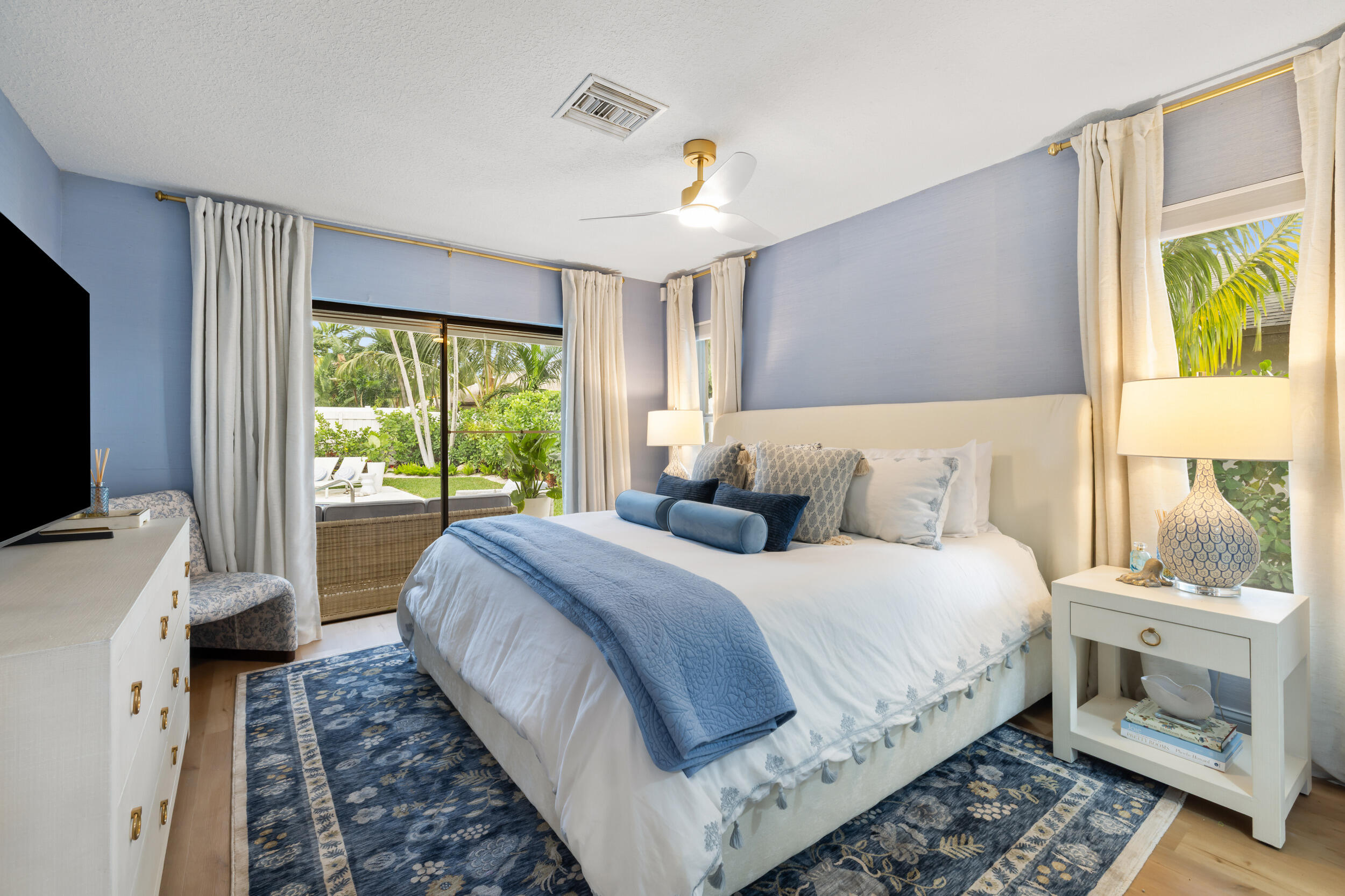 2512 Southwest 5th Street Boynton Beach, FL 33435 - Photo 16 of 37 a bed room with a bed and a large window