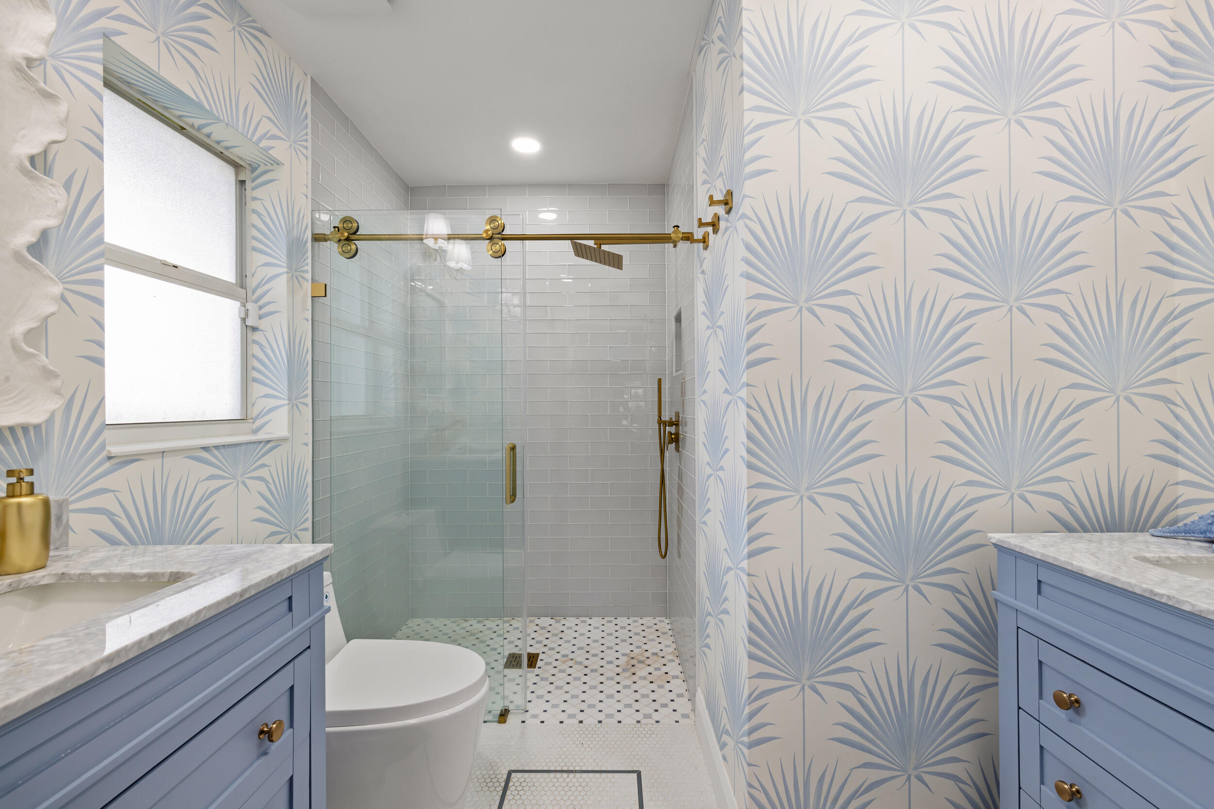 2512 Southwest 5th Street Boynton Beach, FL 33435 - Photo 17 of 37 a bathroom with a granite countertop bathtub sink vanity mirror and toilet