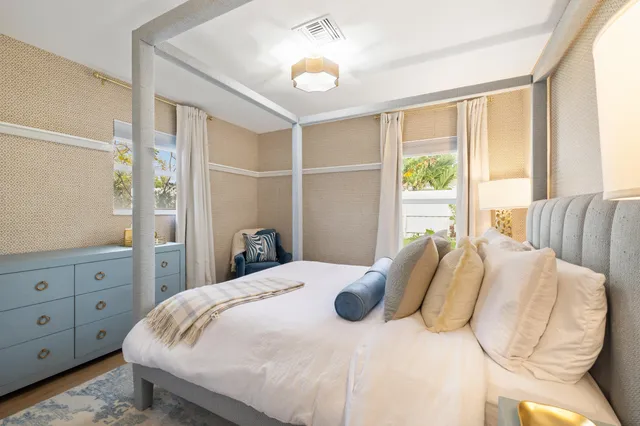 a bedroom with a bed and a dresser