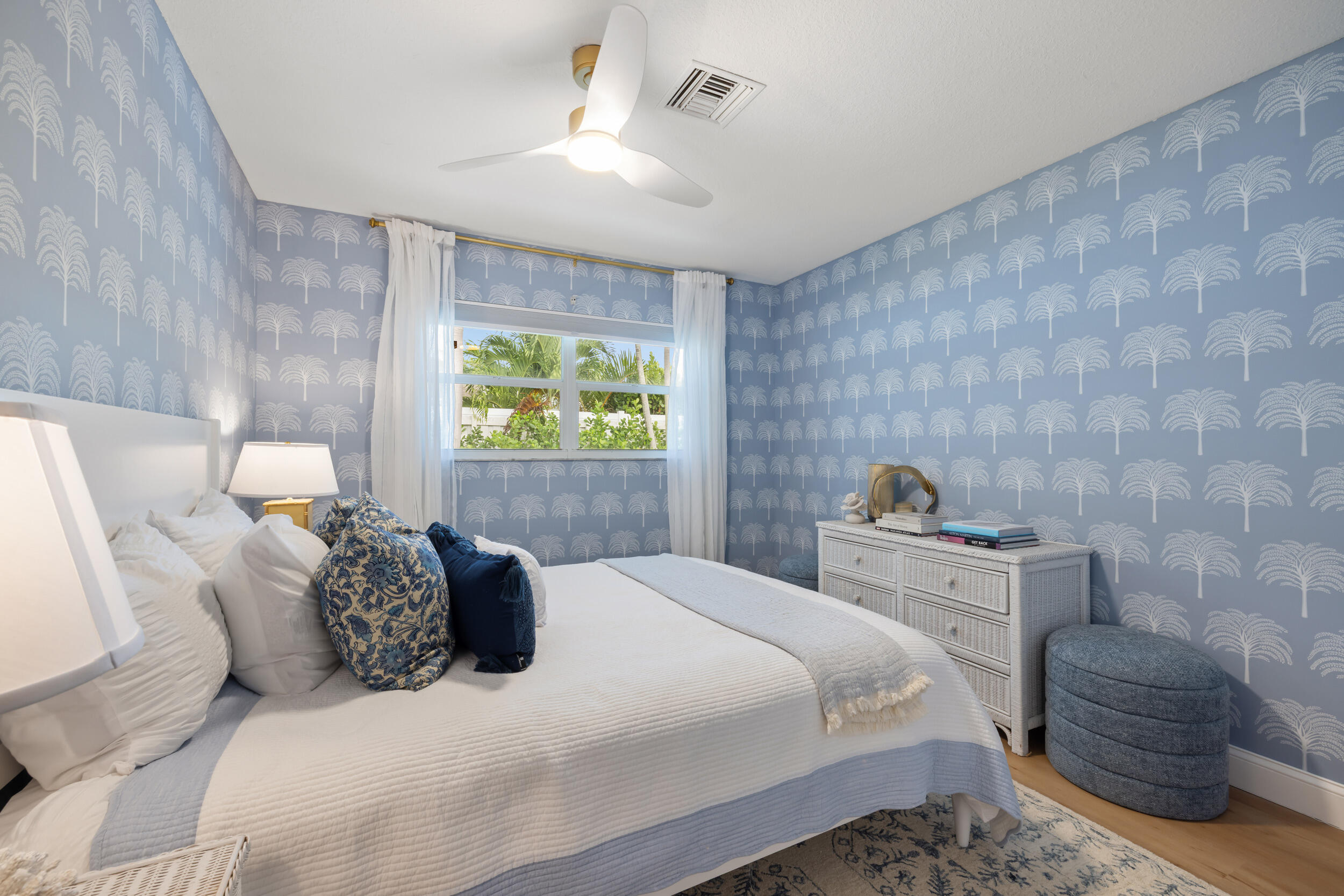 2512 Southwest 5th Street Boynton Beach, FL 33435 - Photo 20 of 37 a bedroom with a bed and a chandelier