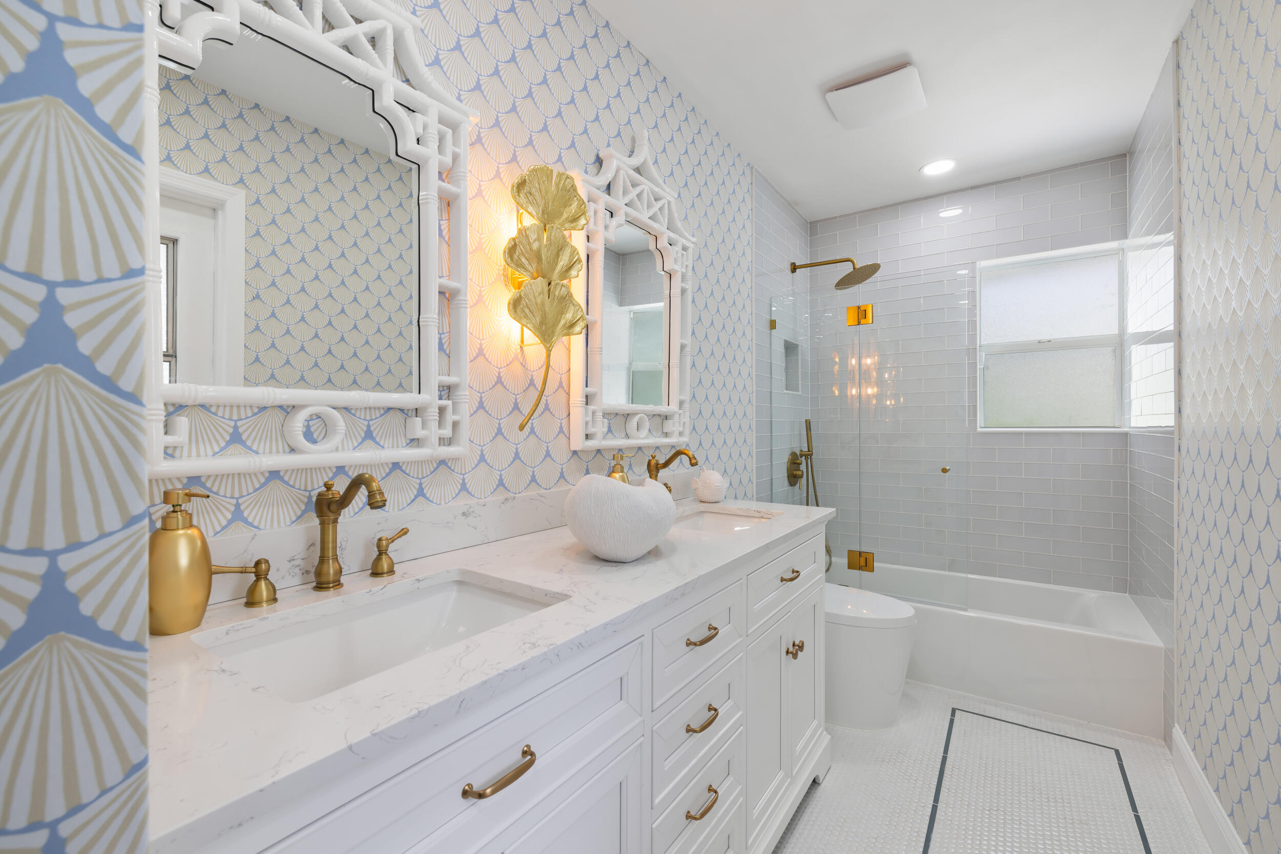 2512 Southwest 5th Street Boynton Beach, FL 33435 - Photo 21 of 37 a bathroom with a granite countertop sink and a mirror