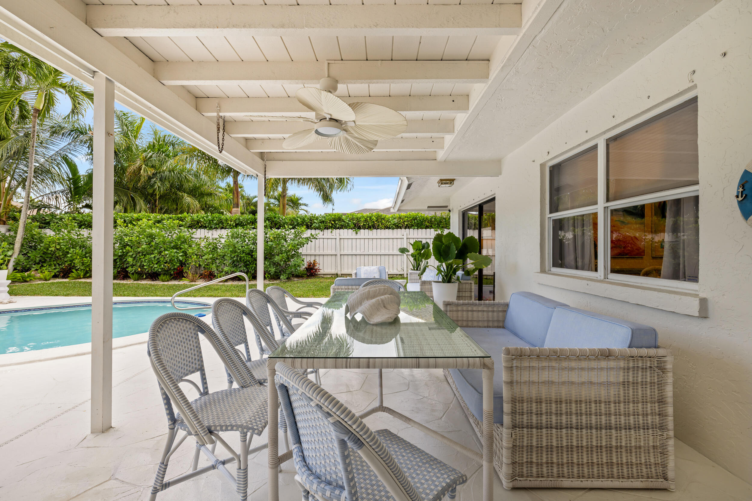 2512 Southwest 5th Street Boynton Beach, FL 33435 - Photo 22 of 37 a view of a dining room with furniture wooden floor and chandelier