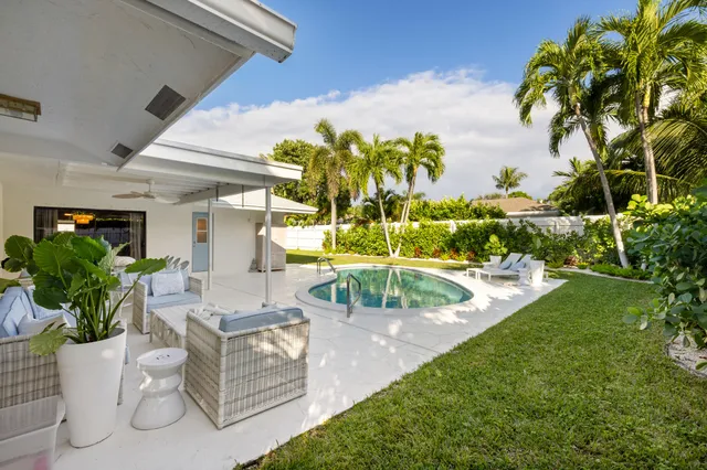 a view of a swimming pool with a patio