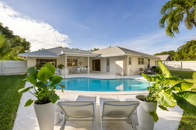 a house view with a seating space and garden
