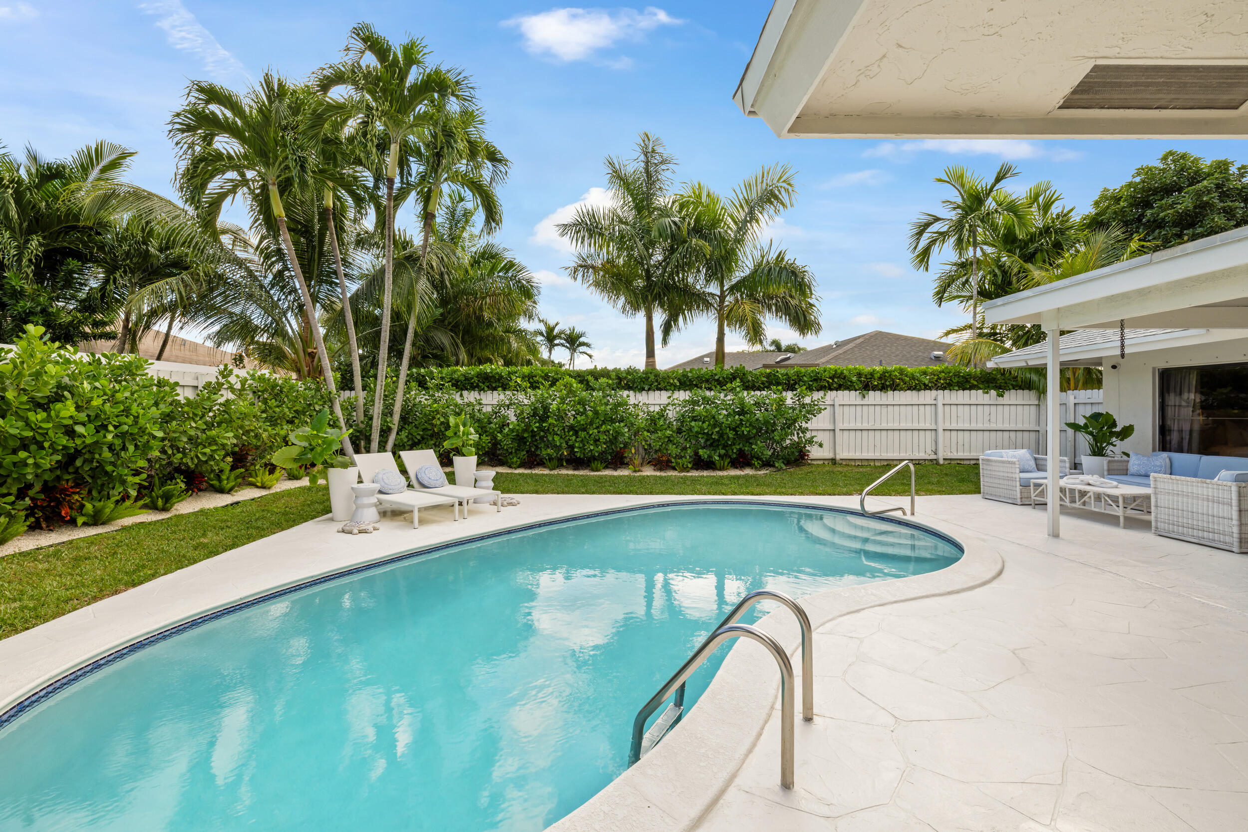 2512 Southwest 5th Street Boynton Beach, FL 33435 - Photo 31 of 37 a view of a swimming pool with a patio