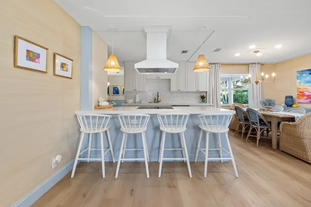 a dining room with furniture a rug and wooden floor