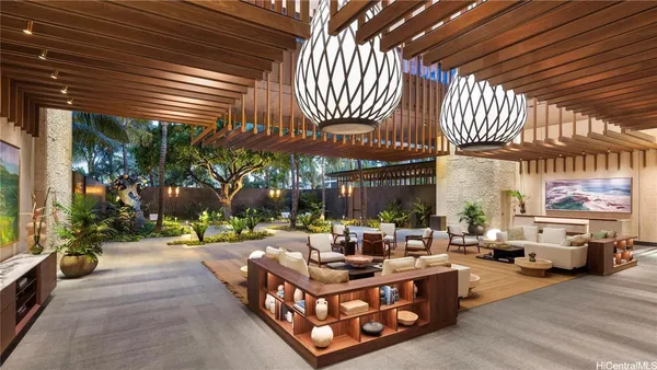 a view of a house with backyard porch and sitting area
