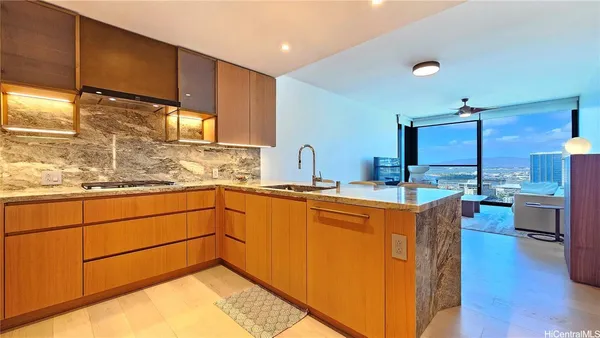 a kitchen with stainless steel appliances granite countertop a sink and cabinets