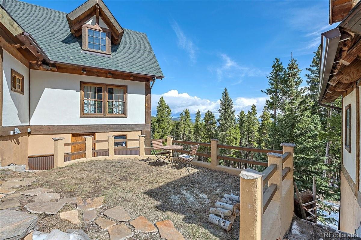 2229 Sinton Road Evergreen, CO 80439 - Photo 28 of 38 a front view of a house with a yard