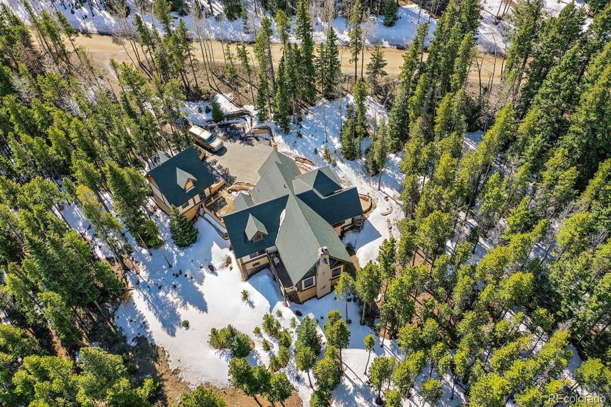 2229 Sinton Road Evergreen, CO 80439 - Photo 38 of 38 an aerial view of a house with yard and outdoor space