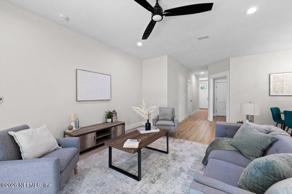 9019 Hipps Road Jacksonville, FL 32222 - Photo 24 of 35 a living room with furniture and a rug