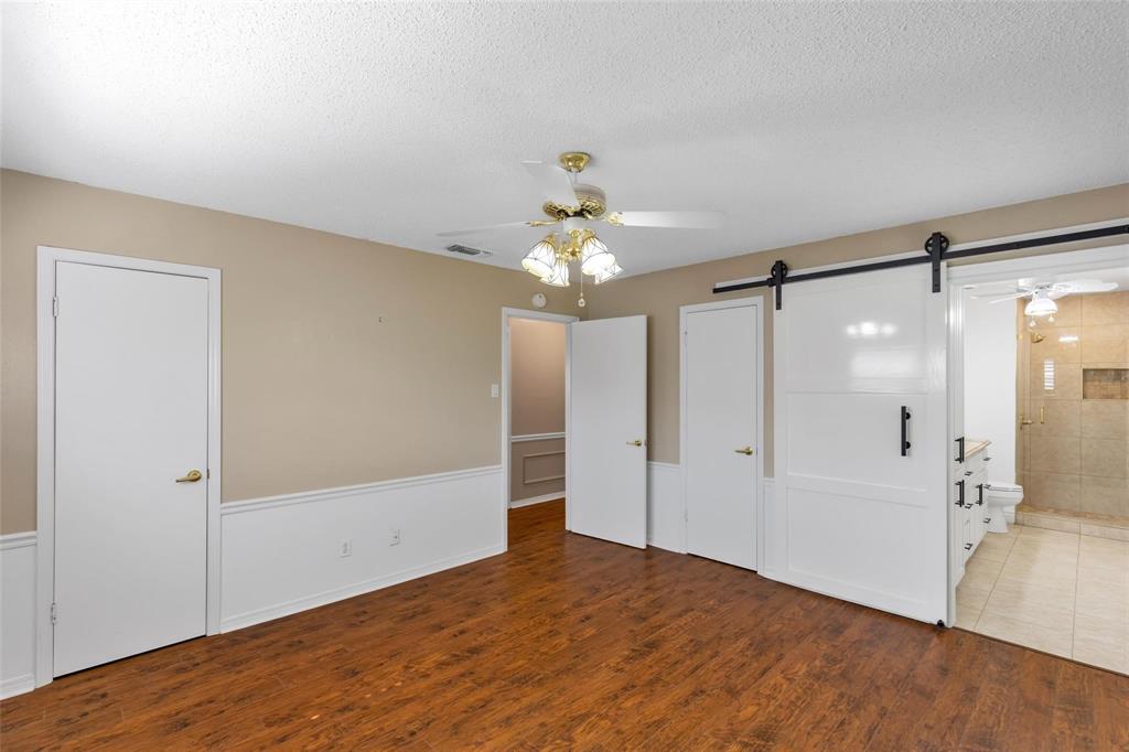 625 Deer Drive Greenville, TX 75402 - Photo 13 of 29 a bathroom with a shower and a mirror