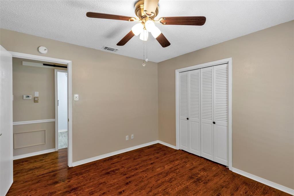 625 Deer Drive Greenville, TX 75402 - Photo 16 of 29 wooden floor in an empty room