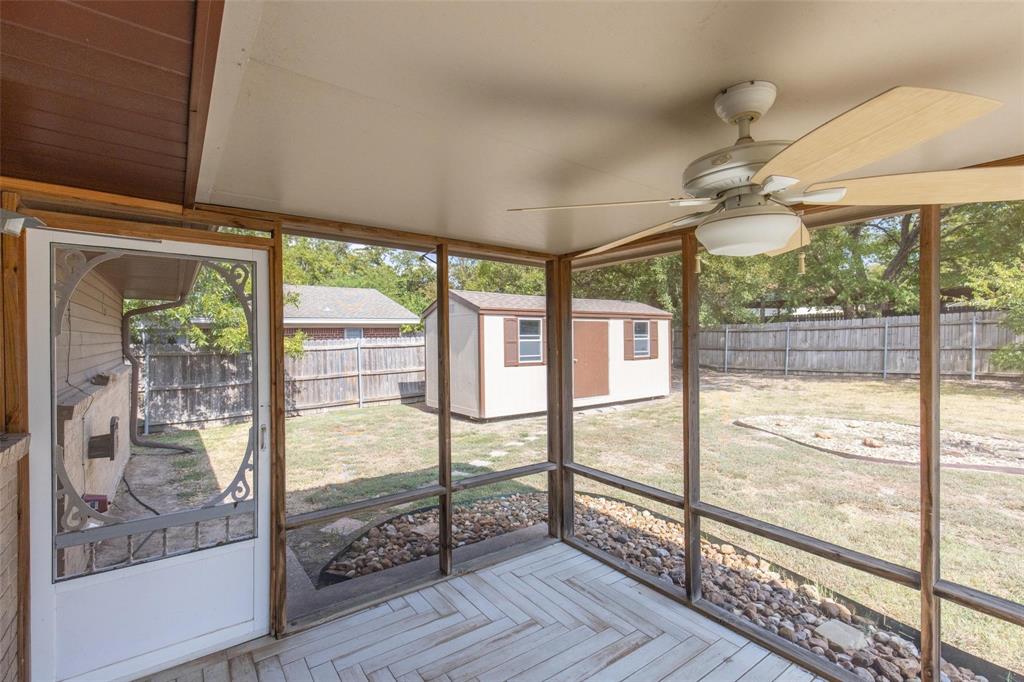 625 Deer Drive Greenville, TX 75402 - Photo 21 of 29 a view of an empty room with wooden floor and a window