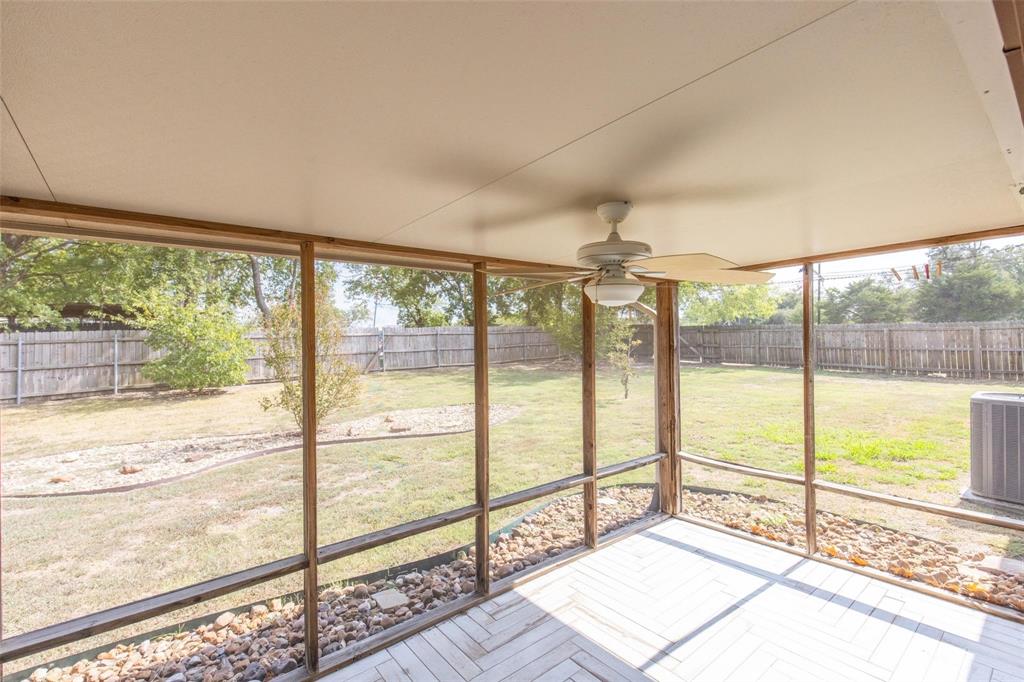625 Deer Drive Greenville, TX 75402 - Photo 22 of 29 a view of a room with wooden floor and windows