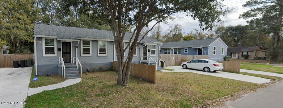 3615 Charles Street Jacksonville, FL 32209 - Photo 2 of 13 a view of a house with a yard and large trees