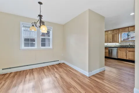 a view of a kitchen with a stove cabinets and wooden floor