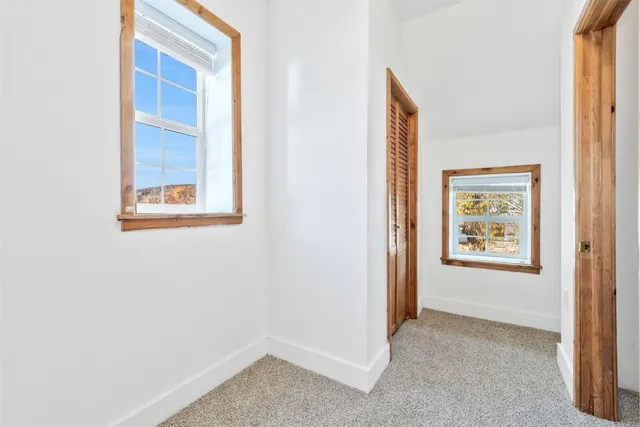 a view of an empty room and window