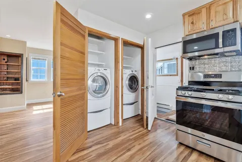 a kitchen with stainless steel appliances granite countertop a stove and a refrigerator