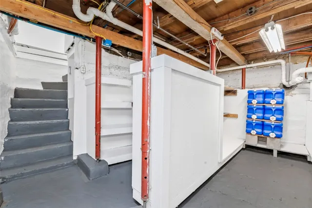 a view of an empty room with white walls