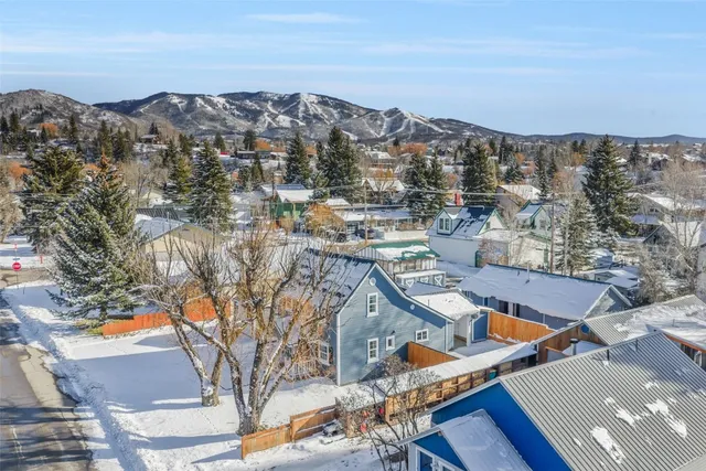 a view of multiple houses with outdoor space