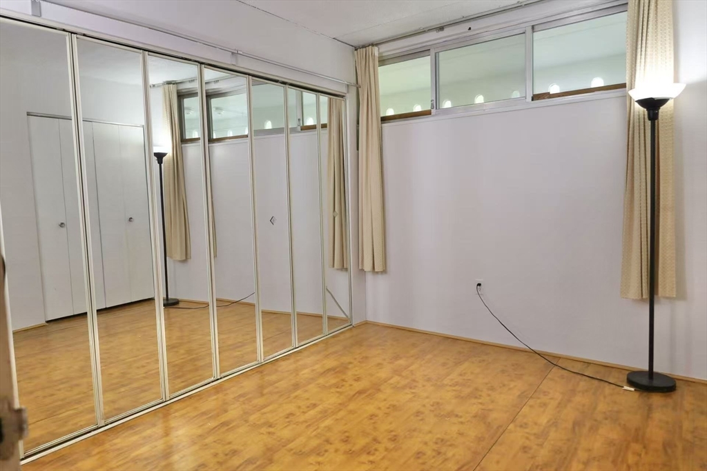 200 Swanton Street, Unit 237 Winchester, MA 01890 - Photo 9 of 14 a view of an empty room with windows