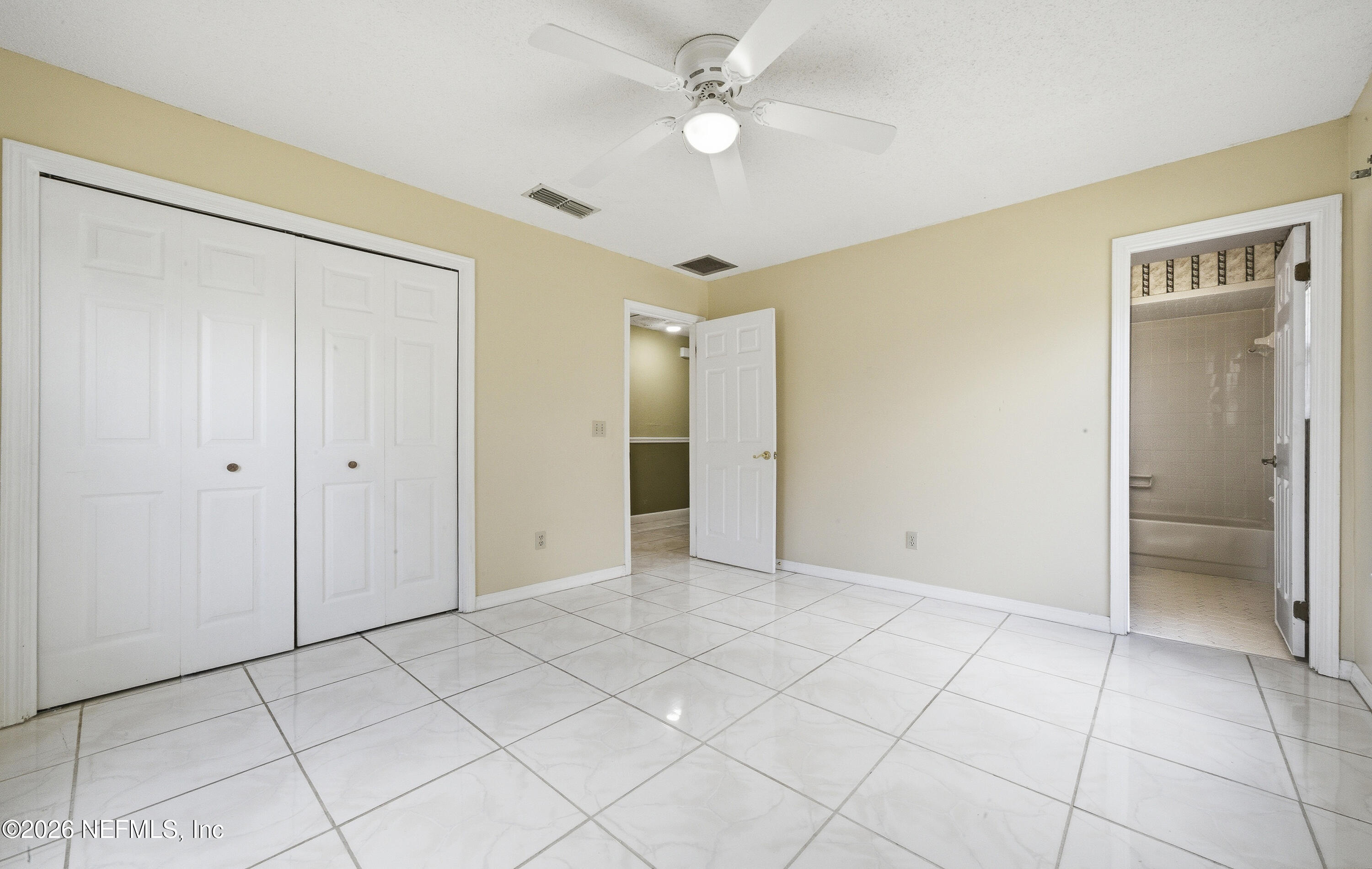 1722 Farm Way Middleburg, FL 32068 - Photo 16 of 37 a view of an empty room with a ceiling fan