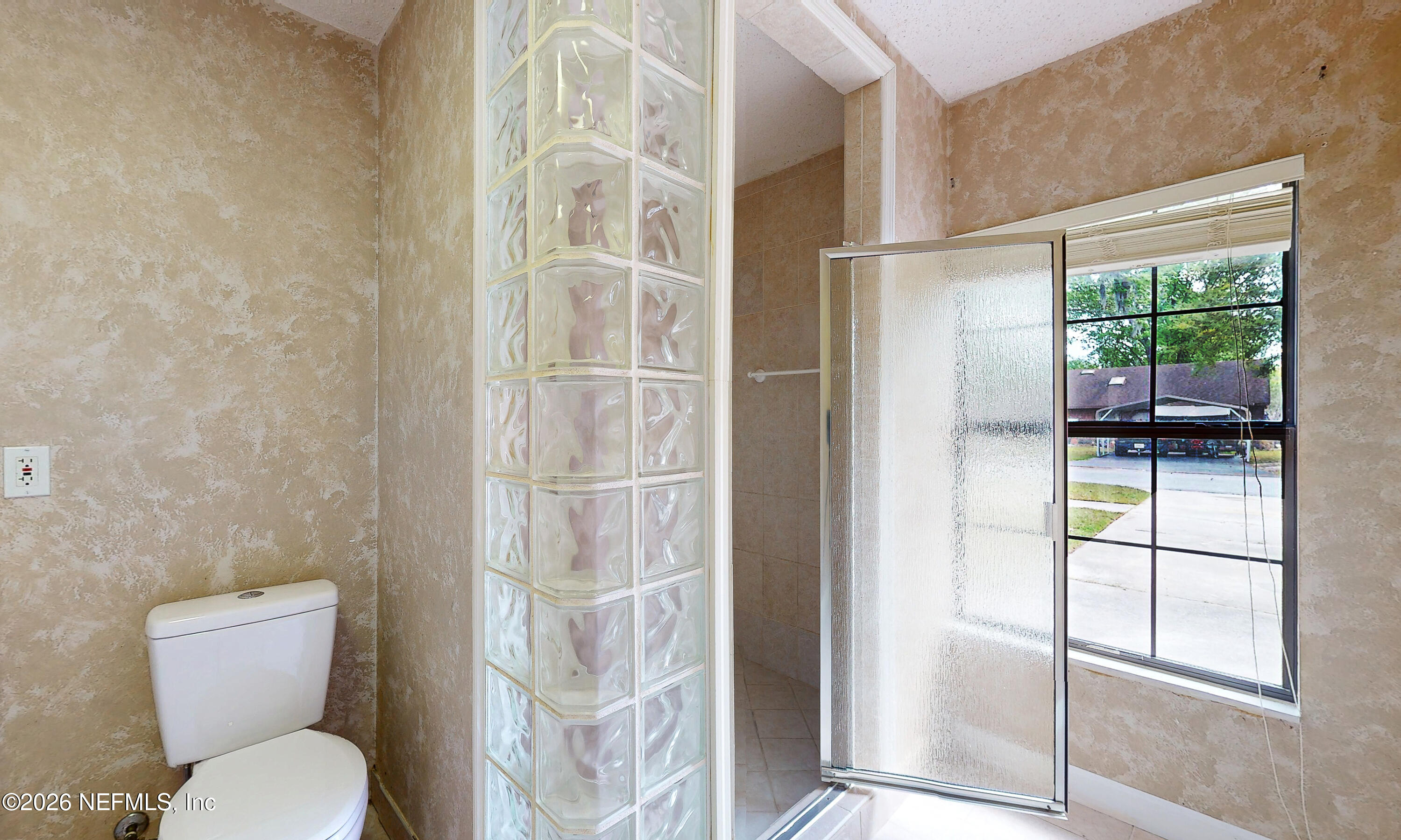 1722 Farm Way Middleburg, FL 32068 - Photo 22 of 37 a bathroom with a toilet and a shower