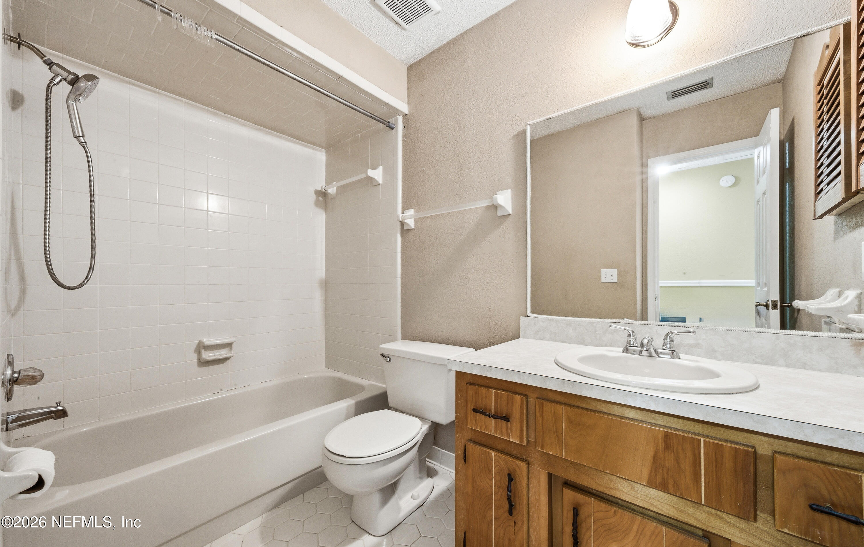 1722 Farm Way Middleburg, FL 32068 - Photo 25 of 37 a bathroom with a granite countertop sink a toilet and shower
